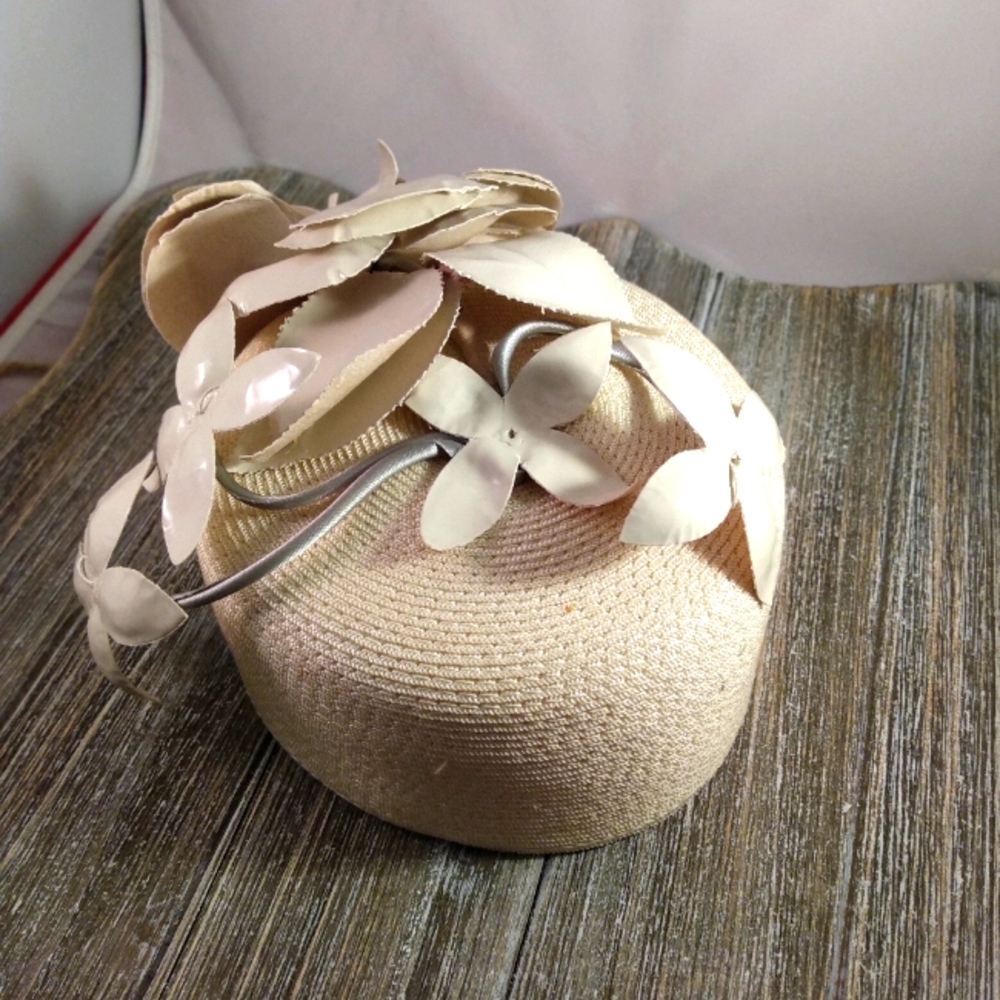 This is a whimsical vintage light beige woman's hat.